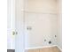Laundry area with shelving and hookups for a washer and dryer at 4626 Derby Loop, Fairburn, GA 30213