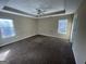 Bright bedroom with two windows and neutral walls at 270 Mountain Way, Covington, GA 30016