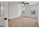 Bright bedroom featuring neutral carpeting and large windows at 551 Lees Mill Rd, Fayetteville, GA 30214