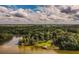 Aerial view highlighting lakefront property with dock and spacious yard at 183 Madden Rd, Bowdon, GA 30108