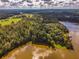 Aerial view of property showcasing lakefront location and lush surroundings at 183 Madden Rd, Bowdon, GA 30108