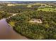 Aerial view highlighting private lakefront estate at 183 Madden Rd, Bowdon, GA 30108