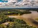 Aerial view showcasing expansive lakefront property at 183 Madden Rd, Bowdon, GA 30108