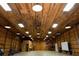 Spacious barn interior with high ceilings, exposed beams, and American flag at 183 Madden Rd, Bowdon, GA 30108