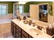 Double vanity bathroom with a large mirror and beige countertops at 183 Madden Rd, Bowdon, GA 30108