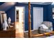 Serene bedroom with a four-poster bed and access to a private bathroom at 183 Madden Rd, Bowdon, GA 30108
