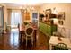 Elegant dining room, hardwood floors, chandelier, and built-in hutch at 183 Madden Rd, Bowdon, GA 30108