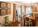 Bright dining room with hardwood floors and a large farmhouse table at 183 Madden Rd, Bowdon, GA 30108