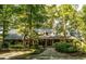Brick home with large covered porch and stone walkway at 183 Madden Rd, Bowdon, GA 30108