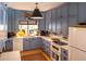 Modern kitchen with blue cabinets and a large island at 183 Madden Rd, Bowdon, GA 30108
