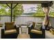 Relaxing lakefront porch with wicker chairs and stunning water views at 183 Madden Rd, Bowdon, GA 30108