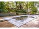 Large inground pool with safety cover and diving board; backyard view at 183 Madden Rd, Bowdon, GA 30108