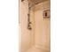 Updated shower with a sliding shower door and marble-like walls at 183 Madden Rd, Bowdon, GA 30108