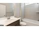 Bathroom with tub, shower, and vanity with mirror at 613 Cork St, Woodstock, GA 30188