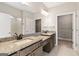 Bathroom with double vanity, granite countertop and walk-in closet at 613 Cork St, Woodstock, GA 30188