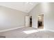 Main bedroom with carpet, ceiling fan, and ensuite bathroom access at 613 Cork St, Woodstock, GA 30188