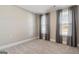 Bright bedroom with carpet and neutral wall colors at 613 Cork St, Woodstock, GA 30188