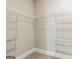 Spacious closet with wire shelving and hanging rods at 613 Cork St, Woodstock, GA 30188