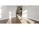 Bright hallway with hardwood floors and natural light at 613 Cork St, Woodstock, GA 30188
