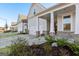 Gray house exterior with front porch and landscaping at 613 Cork St, Woodstock, GA 30188