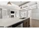 Modern kitchen with island, stainless steel appliances, and white quartz countertops at 613 Cork St, Woodstock, GA 30188