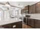 Modern kitchen with dark cabinetry and quartz countertops at 613 Cork St, Woodstock, GA 30188