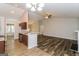Kitchen with brown cabinets, granite countertops, and tile floors at 1949 Greensbrooke Close, Stone Mountain, GA 30088