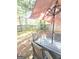Backyard patio with table, chairs, and umbrella at 261 Coral Cir, Mcdonough, GA 30253