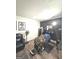 Basement room with barber chair and black leather couch at 261 Coral Cir, Mcdonough, GA 30253