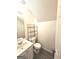 Small bathroom with toilet and sink at 261 Coral Cir, Mcdonough, GA 30253