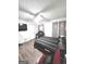 Bright bedroom featuring wood-look floors, and a ceiling fan at 261 Coral Cir, Mcdonough, GA 30253