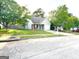 One-story home with attached garage and well-manicured lawn at 261 Coral Cir, Mcdonough, GA 30253