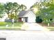 Cozy one-story house with a spacious driveway and well-maintained lawn at 261 Coral Cir, Mcdonough, GA 30253