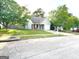 One-story home with attached garage and well-manicured lawn at 261 Coral Cir, Mcdonough, GA 30253