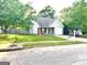 One-story home with attached garage and well-manicured lawn at 261 Coral Cir, Mcdonough, GA 30253