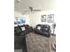 Living room with two black reclining sofas and a TV at 261 Coral Cir, Mcdonough, GA 30253