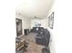 Living Room with black reclining sofas and wood floors at 261 Coral Cir, Mcdonough, GA 30253