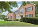 Two-story brick home with a landscaped yard at 4543 Red Tail Dr, Lithonia, GA 30038