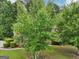 Landscaped yard with mature trees and lush greenery at 4543 Red Tail Dr, Lithonia, GA 30038