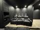 Home theater with black leather recliners and built-in shelving at 172 Oak Forest Se Dr, Smyrna, GA 30082