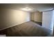 Finished basement bedroom with neutral walls and carpet at 4436 Malibu Dr, Decatur, GA 30035