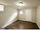 Finished basement bedroom with wood-look flooring at 4436 Malibu Dr, Decatur, GA 30035