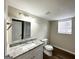 Clean bathroom with granite vanity and updated toilet at 4436 Malibu Dr, Decatur, GA 30035