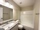 Updated bathroom with granite vanity, bathtub, and updated fixtures at 4436 Malibu Dr, Decatur, GA 30035
