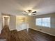 Spacious living room with hardwood floors, a ceiling fan, and large windows at 4436 Malibu Dr, Decatur, GA 30035