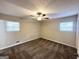 Large main bedroom with ceiling fan, neutral walls and brown carpet at 4436 Malibu Dr, Decatur, GA 30035