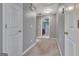 Hallway with gray walls and carpeting at 306 Turtle Pointe Dr, Carrollton, GA 30116