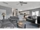 Spacious living room with gray sofas and a kitchen with white cabinets at 306 Turtle Pointe Dr, Carrollton, GA 30116