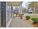 Side porch with brick columns and view of neighborhood at 306 Turtle Pointe Dr, Carrollton, GA 30116