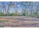 Large backyard with mature trees and open space at 707 Battlecreek Rd, Jonesboro, GA 30236